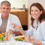 Healthy middle-aged couple enjoying a balanced meal, an example of long-term weight loss maintenance