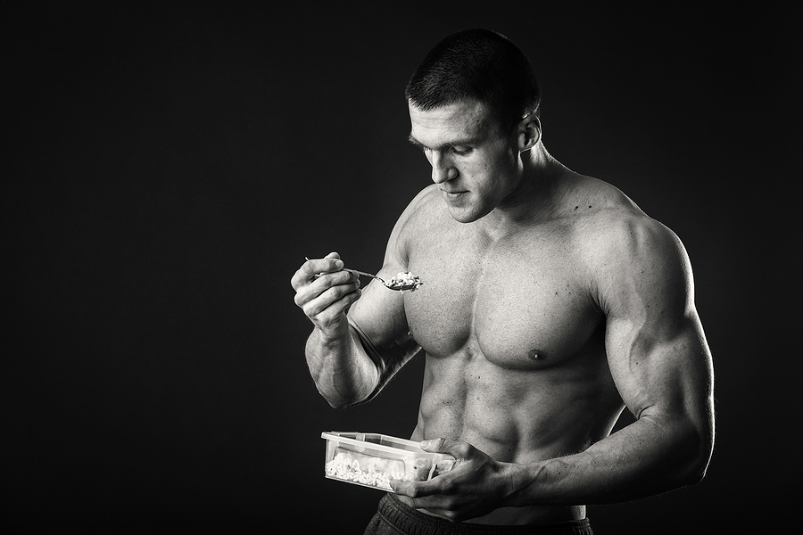 Bodybuilder eating a healthy meal perfect diet