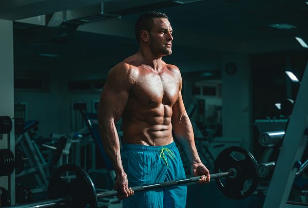 bodybuilder curling a barbell