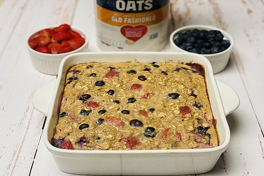 high protein double berry baked oatmeal in baking dish