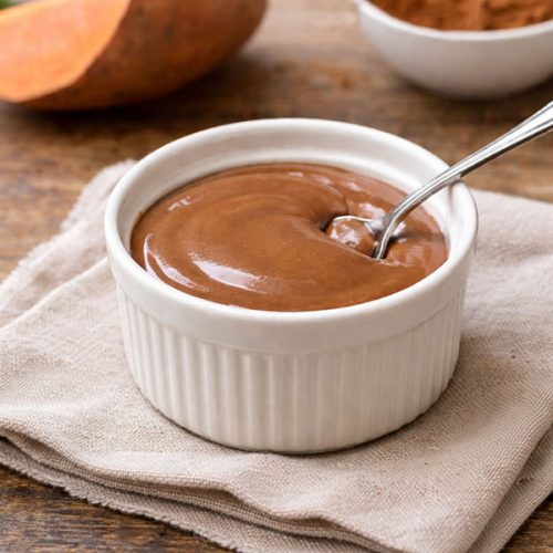 bowl of deep chocolate sweet potato protein pudding