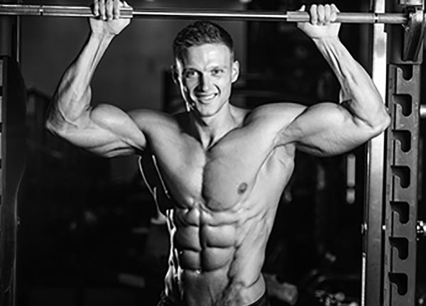 Ripped man showing six pack abs