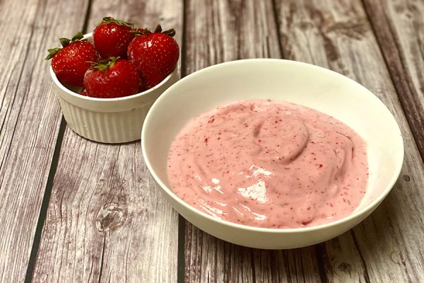 ice cold bowl of strawberry protein ice cream