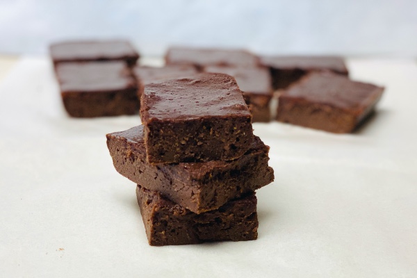 a stack of fudgy sweet potato protein brownies