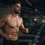 shirtless man showing six pack abs doing cardio on treadmill for fat loss