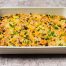 high protein chicken enchilada bake in casserole dish